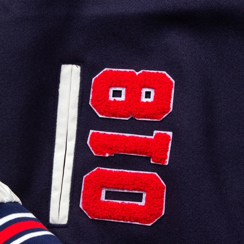 American-style baseball jacket Streetwear CRTZ heavyweight wool-blend jacket with leather sleeves and intricate, high-density embroidery.