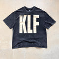 Unisex Vintage T Shirts Saint × KLF Freedom Radio Collaboration T-Shirt. Heavyweight 260g pure cotton fabric (post-wash weight). Vintage single-stitch and blind-stitch construction. Features hand-painted ink splatter, sandblasted wash finish, and dis