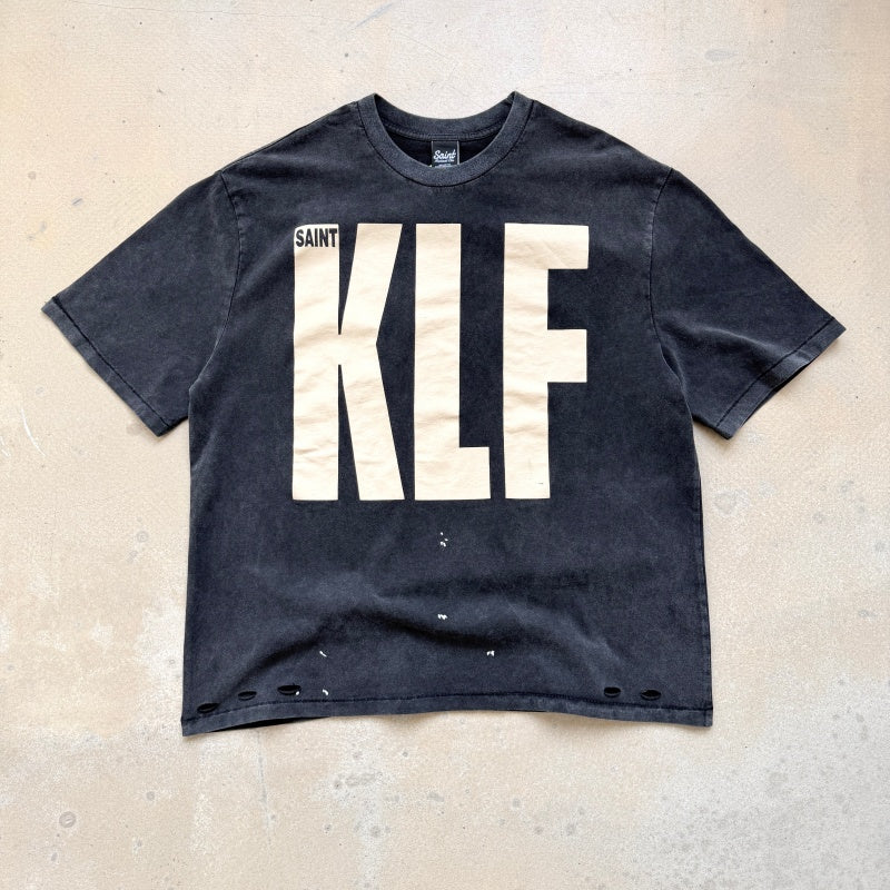 Unisex Vintage T Shirts Saint × KLF Freedom Radio Collaboration T-Shirt. Heavyweight 260g pure cotton fabric (post-wash weight). Vintage single-stitch and blind-stitch construction. Features hand-painted ink splatter, sandblasted wash finish, and dis