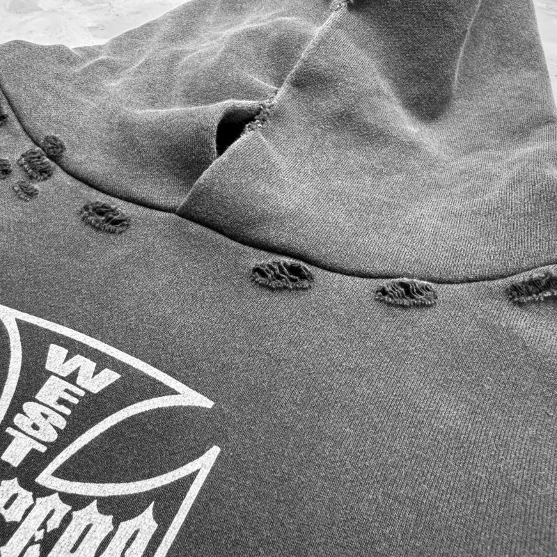 Unisex Vintage Hoodie Limited-edition distressed hooded sweatshirt featuring multi-zone handcrafted distressing details and a heavyweight fabric with an enzyme-washed, faded finish.