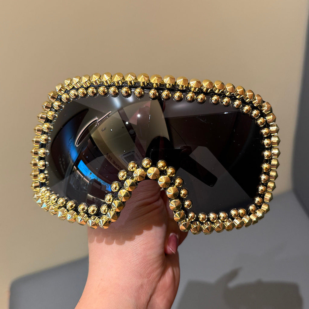 Trendy punk glasses full of diamonds and rivets