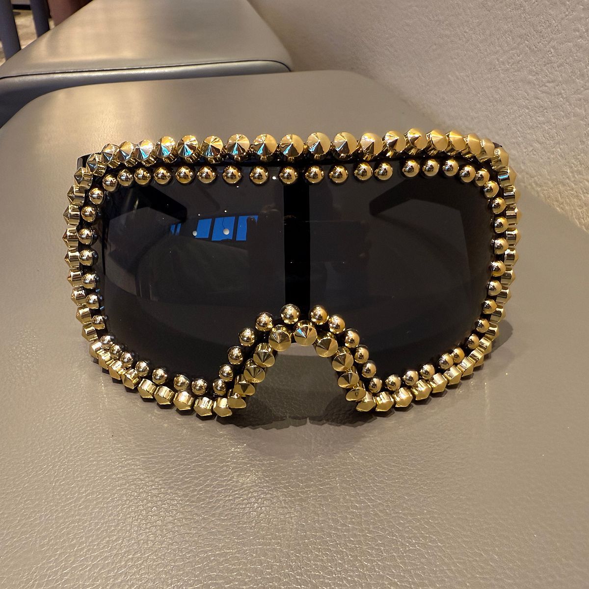Trendy punk glasses full of diamonds and rivets