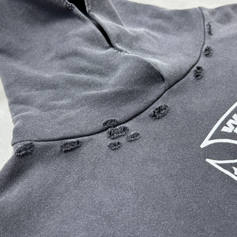 Unisex Vintage Hoodie Limited-edition distressed hooded sweatshirt featuring multi-zone handcrafted distressing details and a heavyweight fabric with an enzyme-washed, faded finish.