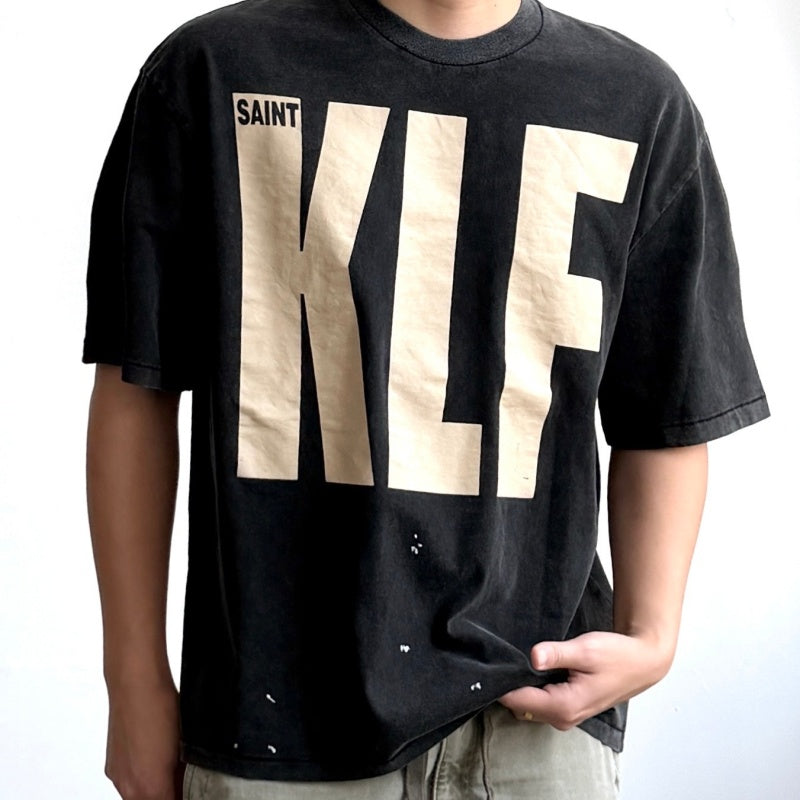 Unisex Vintage T Shirts Saint × KLF Freedom Radio Collaboration T-Shirt. Heavyweight 260g pure cotton fabric (post-wash weight). Vintage single-stitch and blind-stitch construction. Features hand-painted ink splatter, sandblasted wash finish, and dis